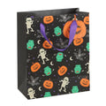 Angled view of Monster Mash Halloween gift bag with pumpkins, bats, mummies and monsters, ideal for trick or treating and spooky gifts