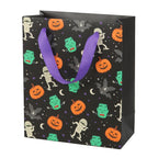 Medium 23cm Halloween trick or treat gift bag with colourful Monster Mash print, crescent moons, stars and purple ribbon handles