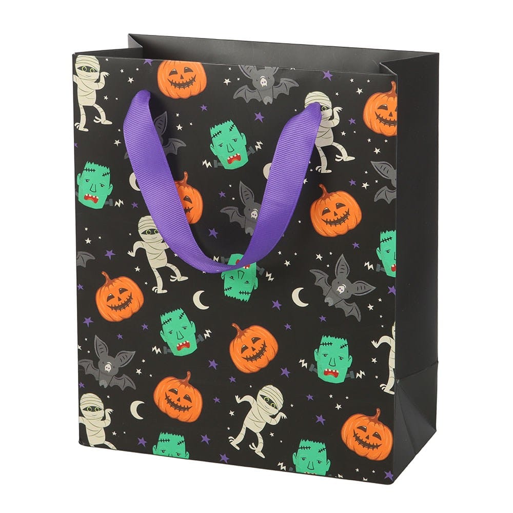 Medium 23cm Halloween trick or treat gift bag with colourful Monster Mash print, crescent moons, stars and purple ribbon handles