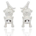 Silver cat earrings on a white background