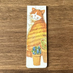 Alex Clark Cat & Pot magnetic bookmark shown folded to demonstrate the secure magnetic design for marking book pages.