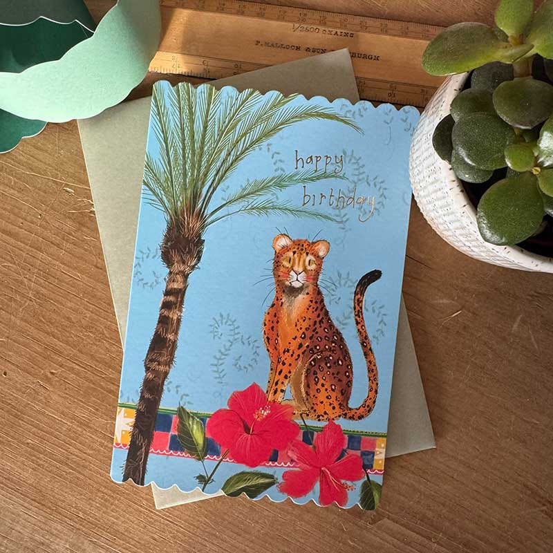 Alex Clark leopard birthday card with tropical palm and red flowers, scalloped edges and gold foil Happy Birthday lettering