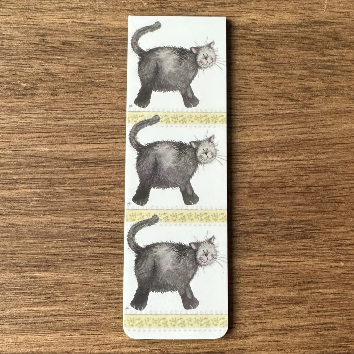 Alex Clark Little Treacle magnetic bookmark shown folded to demonstrate the secure magnetic design for marking book pages.