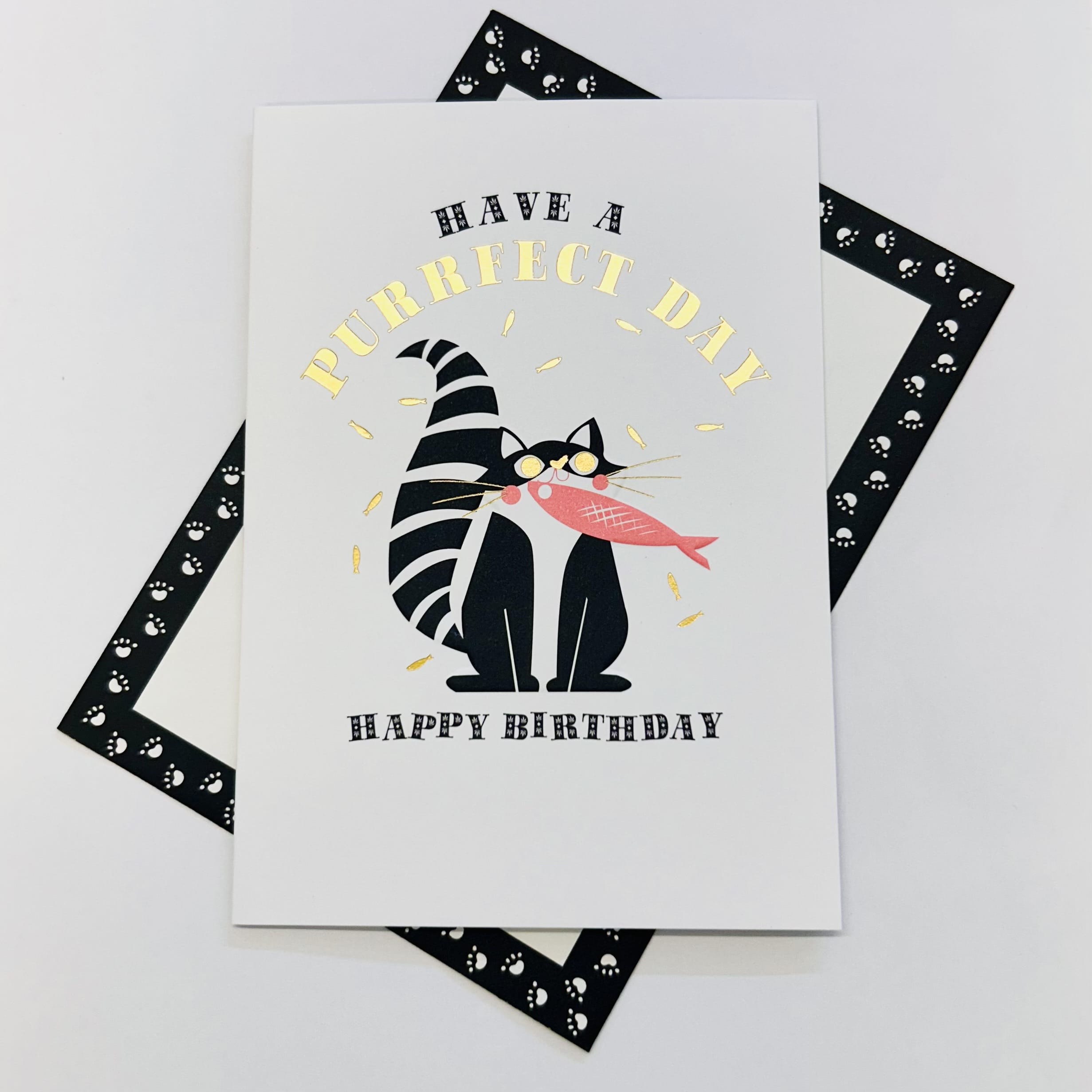 Art File Have a Purrfect Day cat birthday card featuring a black and white cat holding a fish with gold-coloured accents and embossed details on a white background.