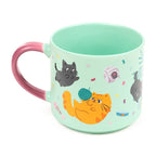 Rear view of Beans & Co Playful Cats porcelain mug showing glossy pink handle, mint green finish and colourful cat-themed illustrations.