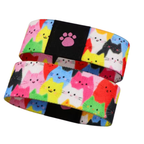 Stretchy reversible wristband bracelet with colourful cat pattern and paw print label