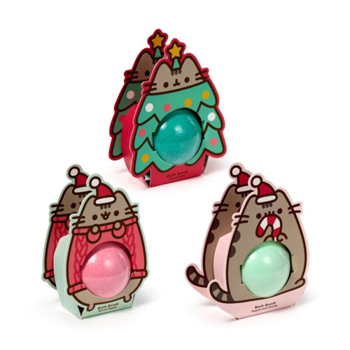 Three Pusheen-themed bath bombs in festive packaging on a white background