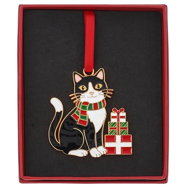 Boxed black and white tuxedo cat Christmas hanging decoration wearing a striped scarf beside wrapped presents