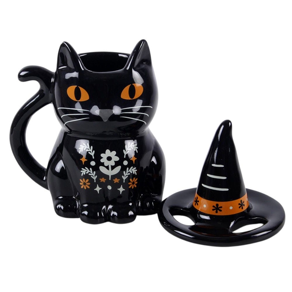 Frightful Folk black cat mug with removable witch's hat lid displayed separately, showing orange eyes and folk floral design
