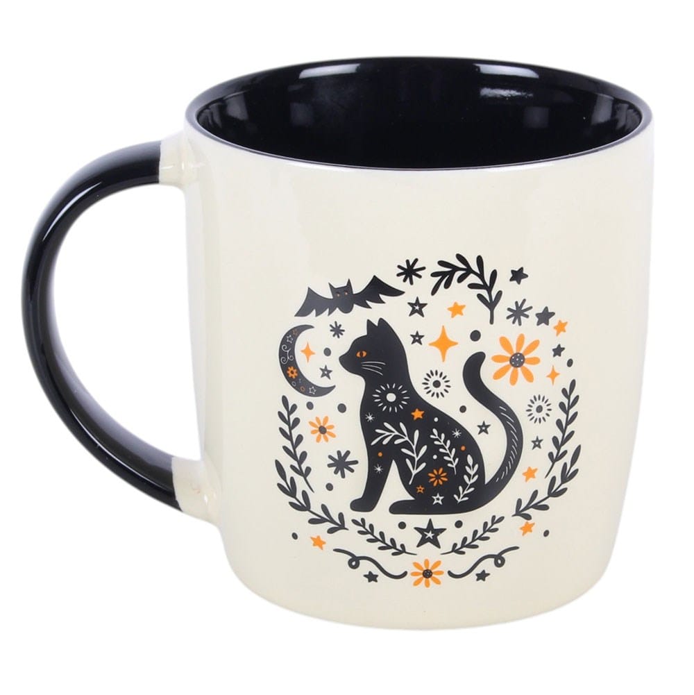Frightful Folk mystical black cat ceramic mug with crescent moon, bat, stars, flowers and botanical folk-art design