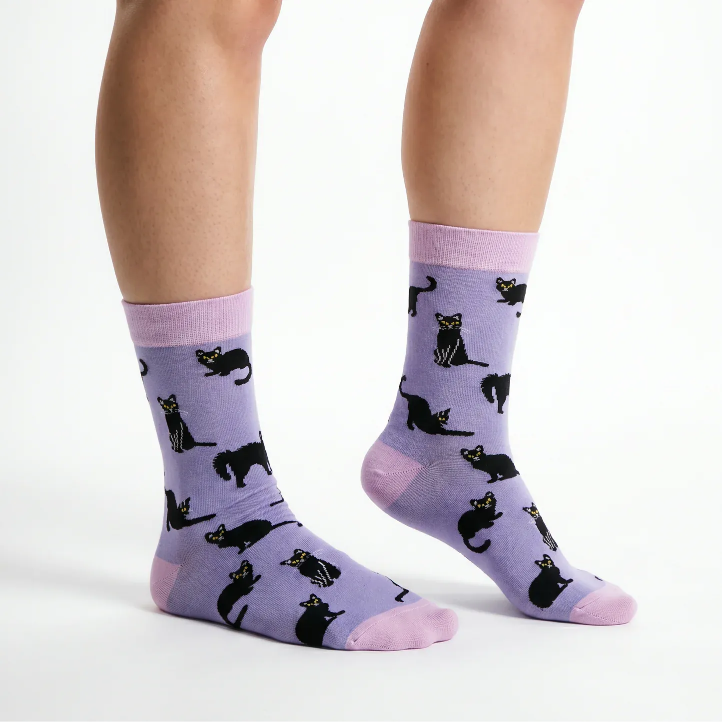 Front view of Socktopus Black Cats bamboo socks in lilac, highlighting the playful black cat design and pink contrast cuffs, heels and toes.