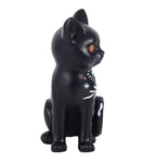 Side view of Frightful Folk black cat Halloween ornament showing bright orange eye, curled decorated tail and mystical folk detailing