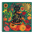 Front artwork of Galison Whiskers of Autumn foil cat puzzle with a striking black cat, emerald-green background, colourful botanical flowers and gold foil accents.