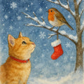 Ginger cat and robin Christmas card featuring a curious ginger cat looking up at a robin and red stocking on a snowy branch with falling snow