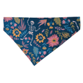 Handmade blue polycotton over the collar bandana for cats and dogs featuring dancing white skeletons among colourful flowers and leaves