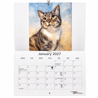 Marie Brown 2027 Cat Calendar open at January with Tabby Blue cat artwork and monthly calendar grid