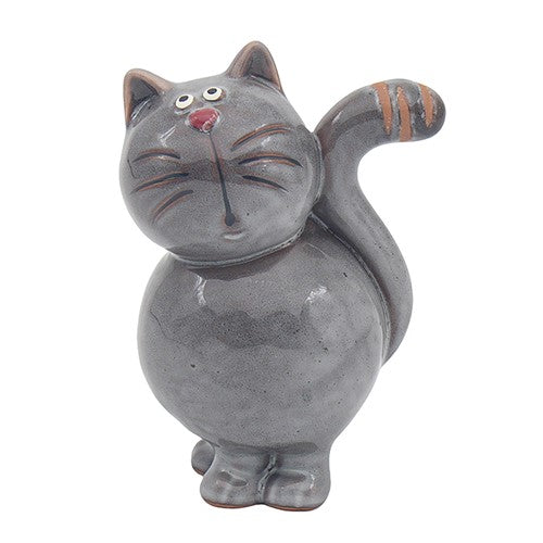 Ceramic cat-shaped figurine with a face on a white background
