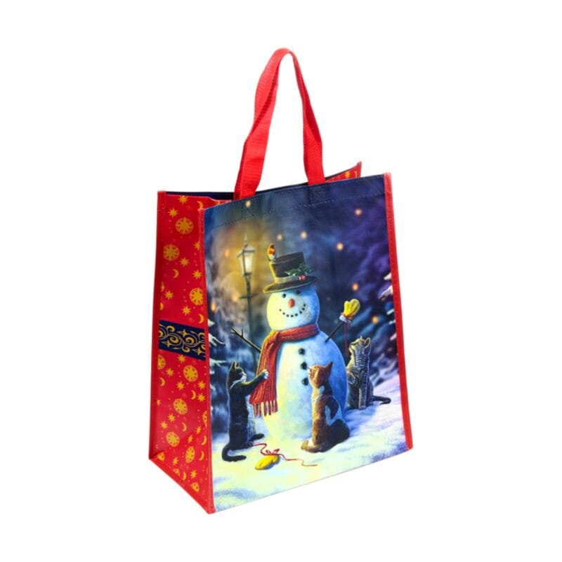 Angled view of Lisa Parker Christmas reusable shopping bag with snowman and cats festive illustration