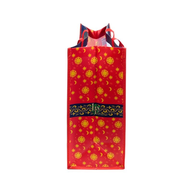 Side view of Lisa Parker Christmas reusable shopping bag showing festive star and moon patterned gusset with snowman artwork