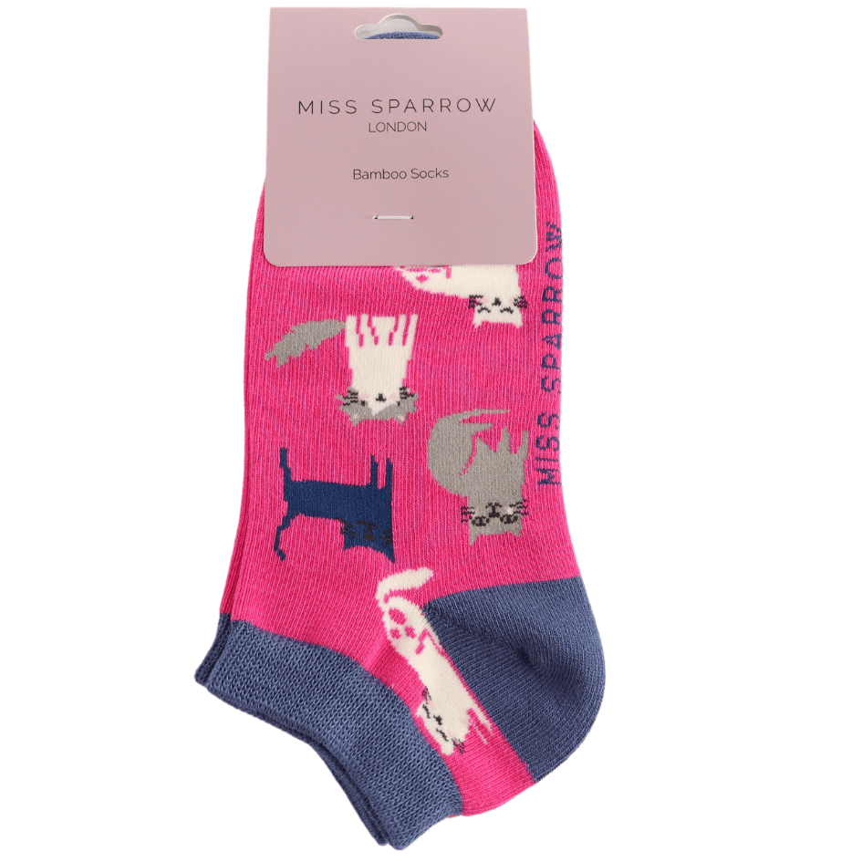 Packaged Miss Sparrow Ladies Cute Kitten bamboo trainer socks in hot pink featuring white, grey and navy kittens with contrasting navy cuffs, heels and toes.