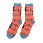 Pair of Miss Sparrow Ladies Bamboo Socks in vibrant orange featuring playful black cat silhouettes sitting on musical staves with navy music notes and contrasting blue-grey heels, toes and cuffs.