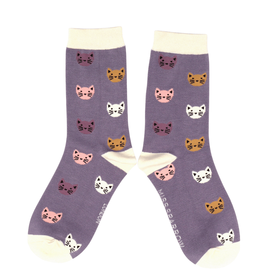 Pair of Miss Sparrow 'Kitty Faces' bamboo socks in lavender, showcasing an all-over pattern of colourful feline faces with contrasting cream heels, toes and cuffs.