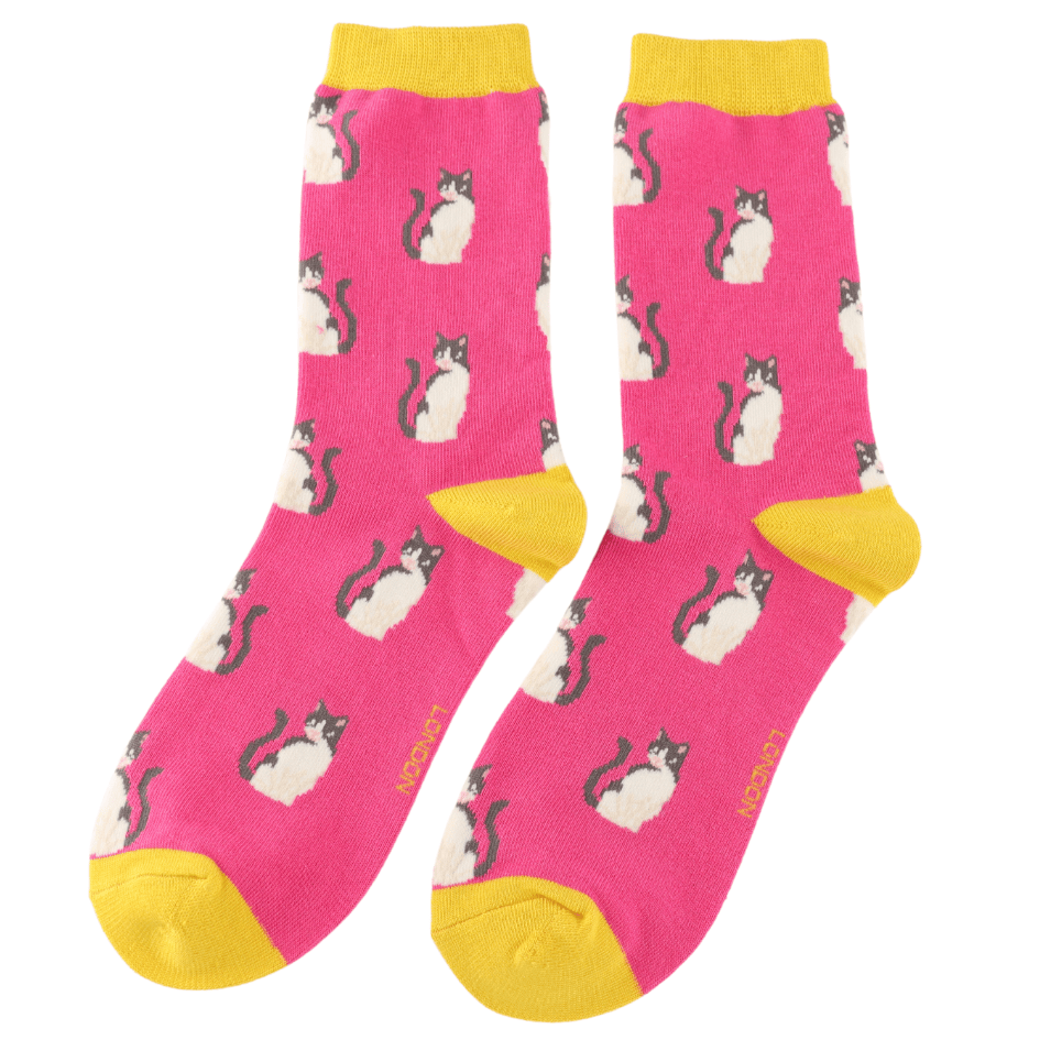 Pair of Miss Sparrow Ladies Bamboo Cat Socks featuring an all-over black and white cat pattern on a vibrant hot pink background with contrasting sunshine yellow heels, toes and cuffs.
