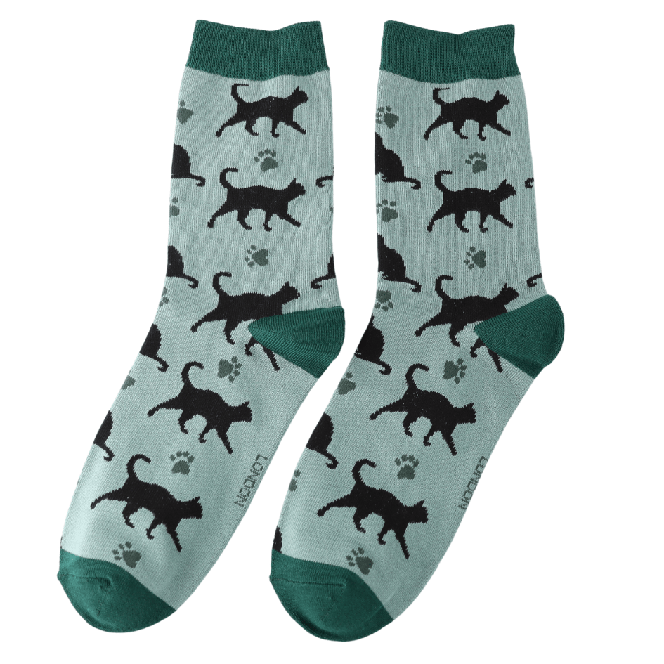 Pair of Miss Sparrow Ladies Bamboo Cat Socks featuring striking black cat silhouettes and delicate paw prints across a soft aqua background, finished with rich teal heels, toes and cuffs.