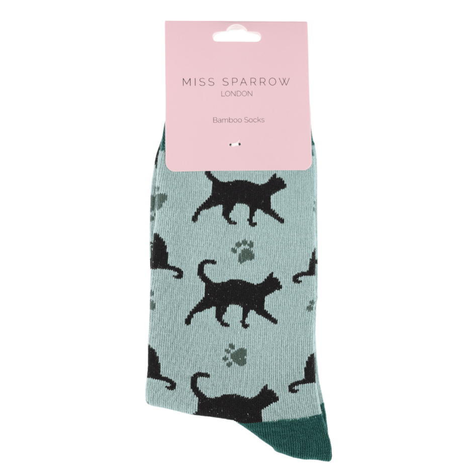 Miss Sparrow Ladies Bamboo Socks 'Cats & Prints' in a fresh aqua colourway, displayed in branded packaging with elegant black cat silhouettes, subtle paw prints and contrasting deep teal toe detail.