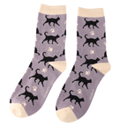 Pair of Miss Sparrow Ladies Bamboo Cat Socks featuring striking black cat silhouettes and cream paw prints across a soft mauve background with matching cream heels, toes and cuffs.