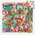 Mudpuppy Merry Catmas 500 piece Christmas jigsaw puzzle nearly completed with loose pieces beside a colourful festive scene of cats, presents and decorations.