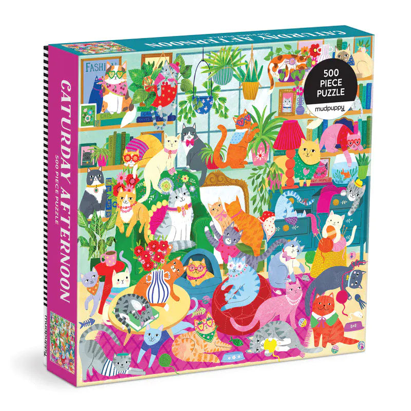 Mudpuppy Caturday Afternoon 500 piece cat jigsaw puzzle box featuring a colourful living room filled with playful cats, houseplants, books and knitting.