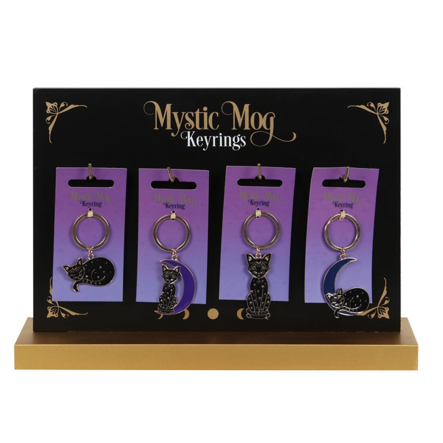 Display of the four Mystic Mog enamel cat keyring designs on retail stand.