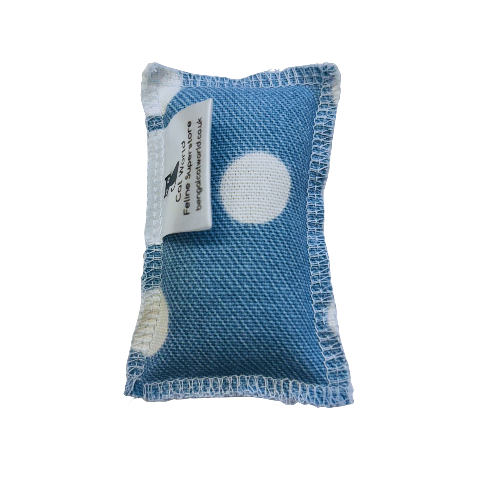 Blue fabric catnip toy with white polka dots on a white background