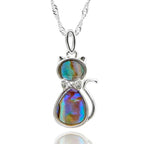 Equilibrium Paua Shell Cat silver plated necklace with iridescent blue green purple shell and sparkling bow