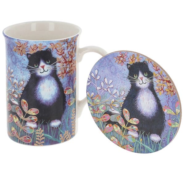 Penny Gaj black and white cat mug and matching round coaster gift set, featuring a tall ceramic mug with green-eyed tuxedo cat artwork surrounded by colourful flowers and foliage.