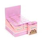 Retail display of multiple boxed Pusheen playing card decks ready for gifting, collecting or family games