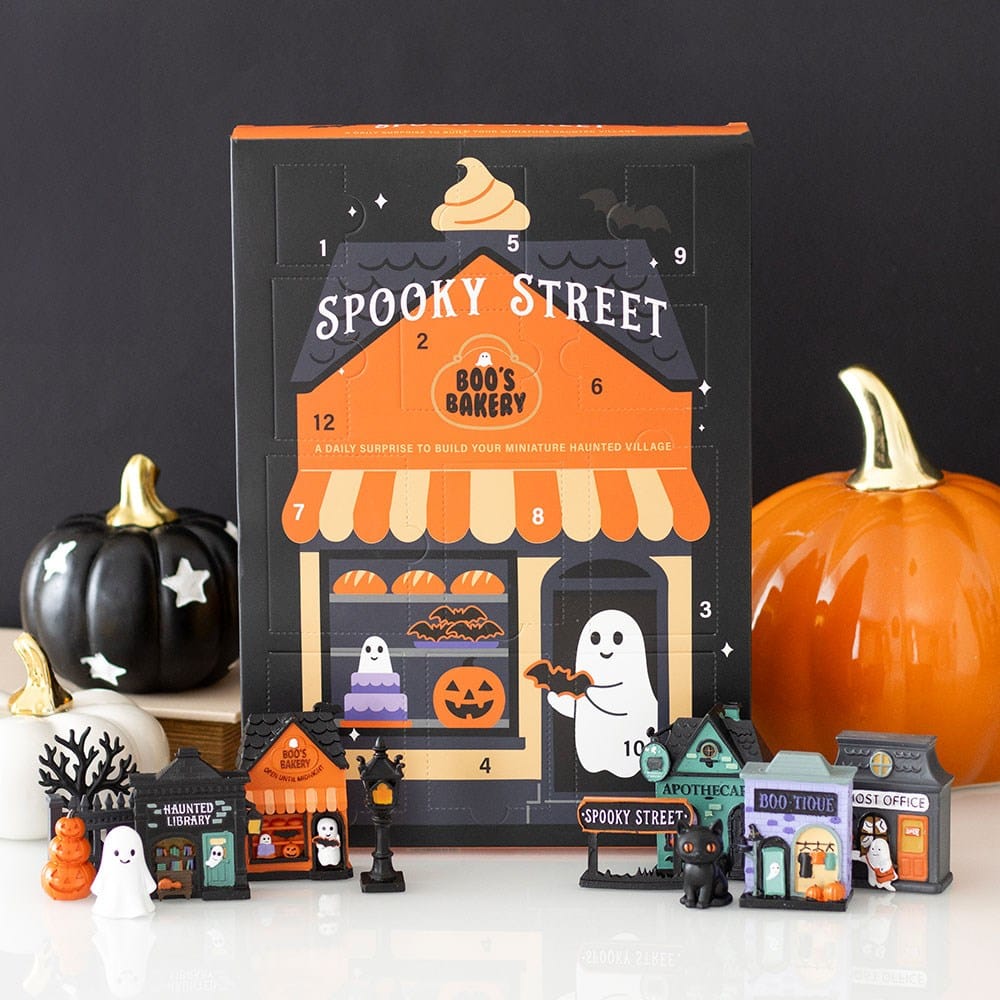 Spooky Street 12-day Halloween advent calendar with miniature haunted village, black cat, ghosts, spooky shops and pumpkin decorations