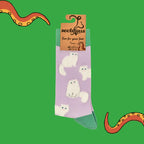 Socktopus Fluffy White Cats combed cotton socks in retail packaging, featuring soft textured white cats on a lilac background with sage green cuffs, heels and toes