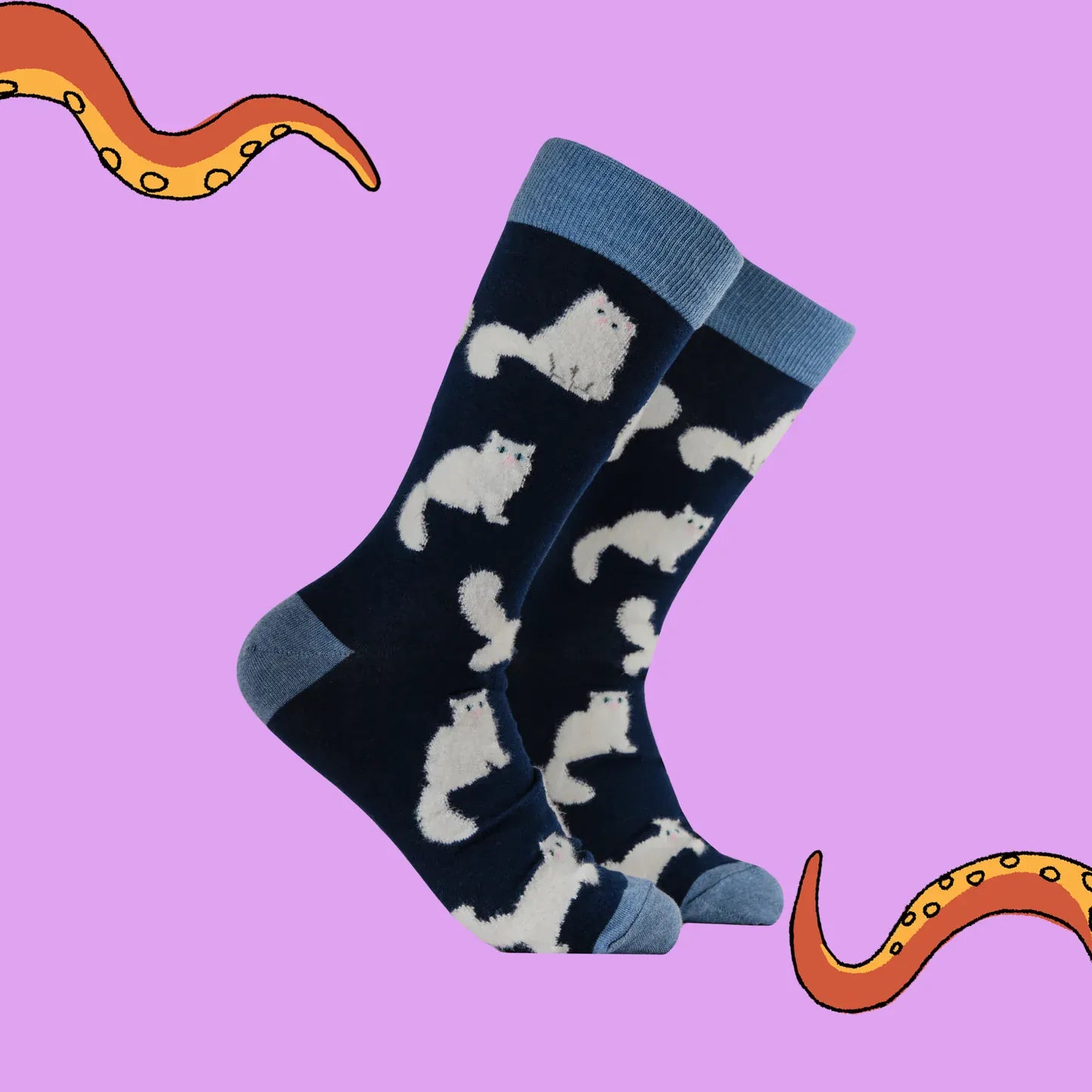 Angled view of Socktopus Fluffy White Cats combed cotton socks showing the raised fluffy white cats against the rich navy background.