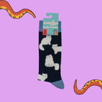 Socktopus Fluffy White Cats combed cotton socks in retail packaging, featuring soft textured white cats on a navy background with pale blue cuffs, heels and toes.