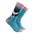 Socktopus Ladies Pro-Cat-stinating cat socks in aqua blue with fluffy black-and-white cat design, black paw prints and contrasting pink cuffs, heels and toes.