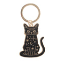 The Protector mystical black cat keyring with black enamel-style finish, gold-tone moons, stars and celestial symbols
