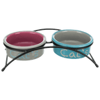 Trixie elevated cat feeding set with turquoise and pink ceramic bowls held in a black powder-coated metal stand