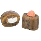Close-up of Trixie Pill Pockets demonstrating how tablets are hidden inside the soft chicken treat.