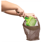 Trixie compostable cat waste bag being used to scoop the less glamorous contents of a litter tray—because all the little jobs count