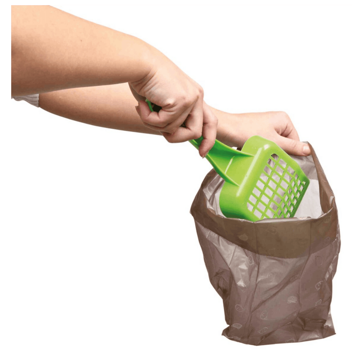 Trixie compostable cat waste bag being used to scoop the less glamorous contents of a litter tray—because all the little jobs count