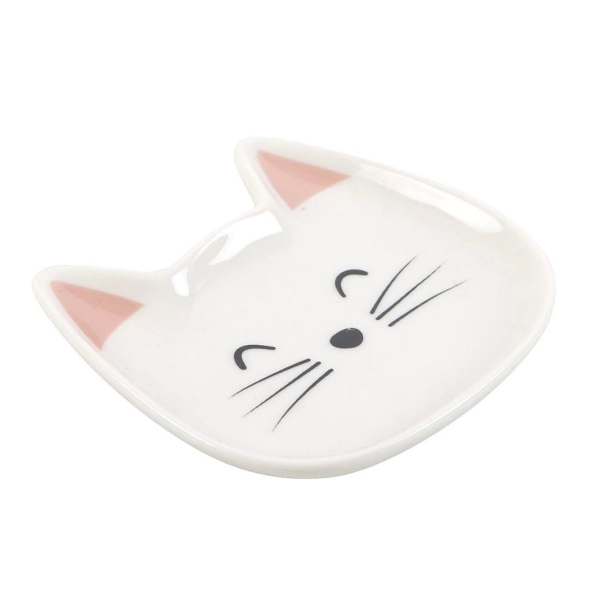 Angled view of white ceramic cat face trinket dish showing its shallow curved shape, pink ears and cute smiling feline design