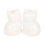 Rear view of two white ceramic cat salt and pepper shakers showing their rounded sitting shapes and dispensing holes on top.