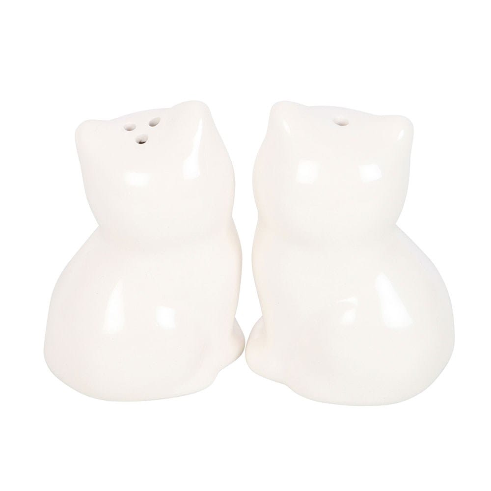 Rear view of two white ceramic cat salt and pepper shakers showing their rounded sitting shapes and dispensing holes on top.